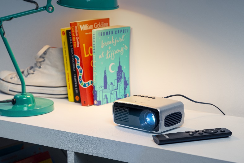 A picture containing indoor, table, desk, sitting

Description automatically generated